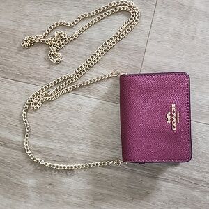 Coach nwot raspberry glitter mini clutch with chain.